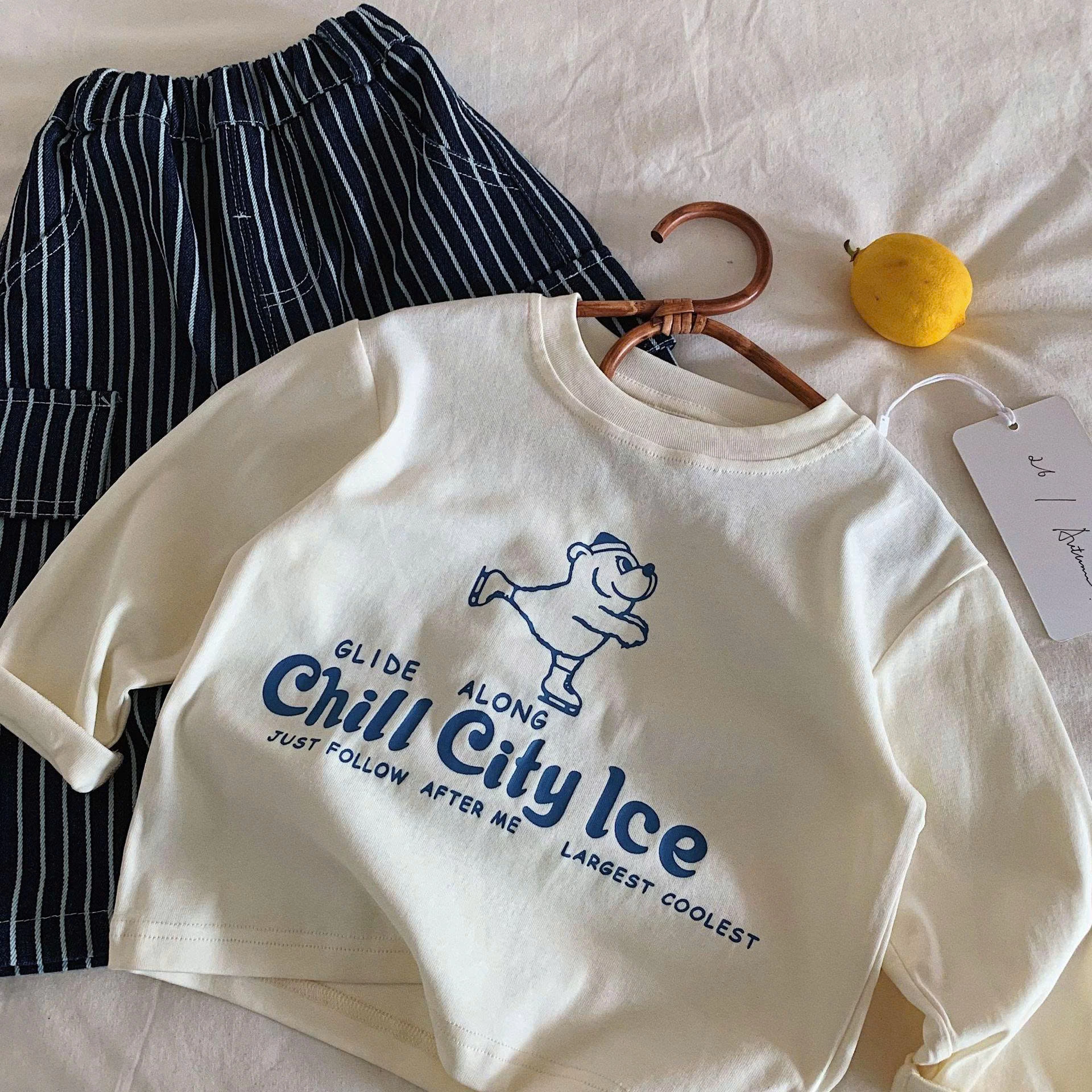ÁO THUN IN HÌNH GẤU TRƯỢT BĂNG