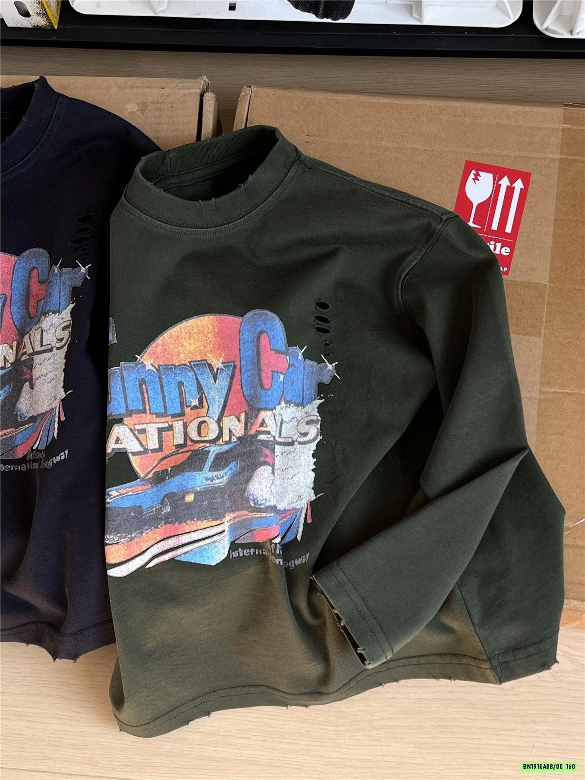 ÁO THUN IN HÌNH RÁCH GẤU