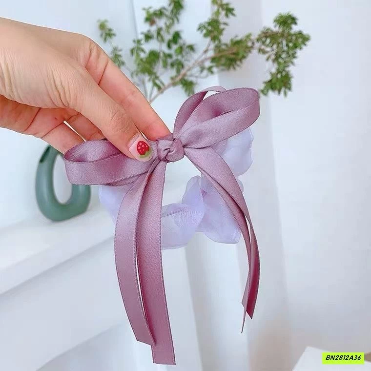 BUỘC TÓC GIẢ NƠ RUY BĂNG